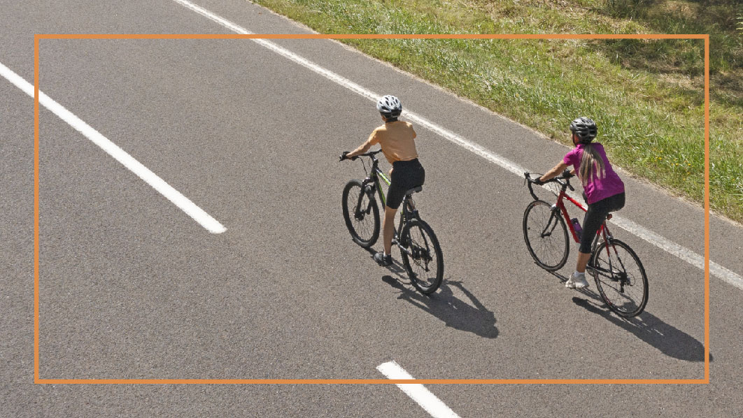 Group of cyclists wearing helmets to help prevent bicycle accidents.