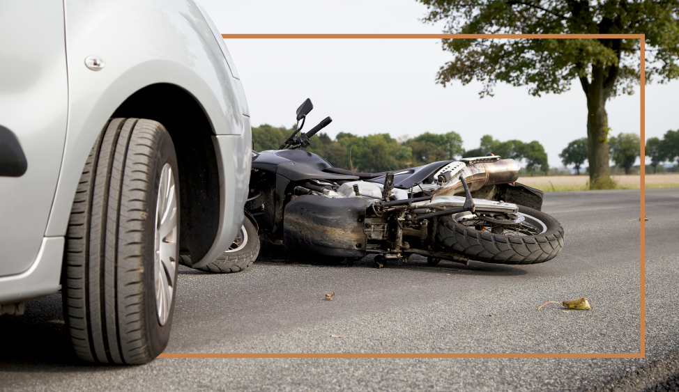 Motorcycle and Car Collision Scene in New Hampshire Damaged motorcycle and car after a collision at a New Hampshire intersection